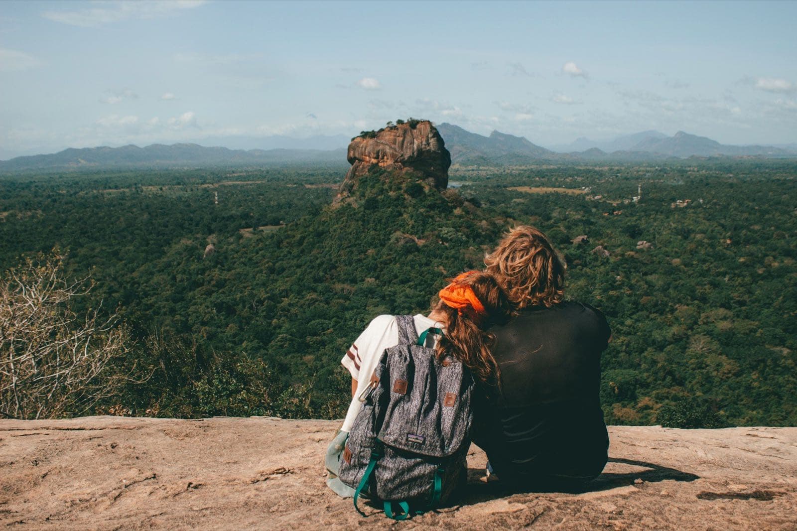 Travellers looking across the landscape towards Sigiriya Rock Fortress