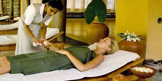 A guest receiving a calming spa therapy at a wellness resort